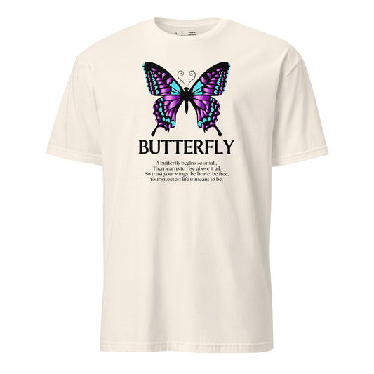 Beige t-shirt with a butterfly graphic and text on a white background