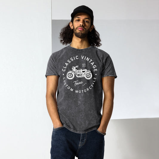 Man wearing a dark gray t-shirt with a motorcycle graphic and text.