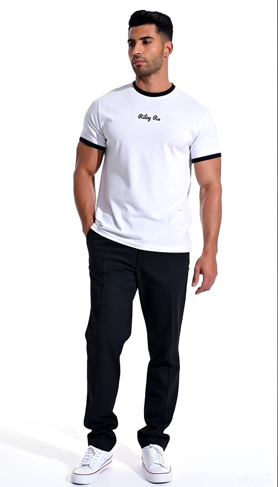 Man wearing a white t-shirt with black trim and black pants on a white background
