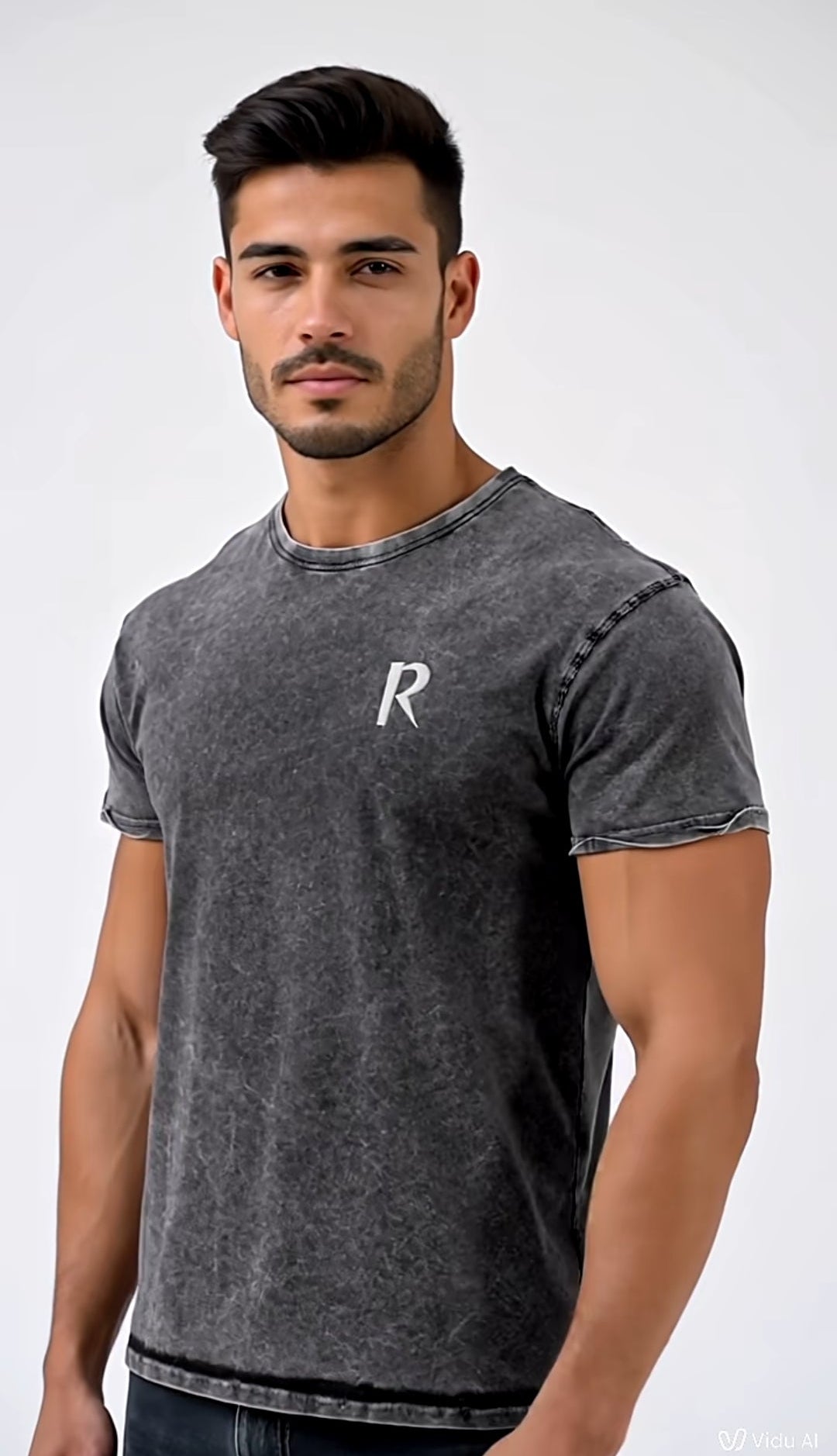 Man wearing a gray t-shirt with a logo on a white background