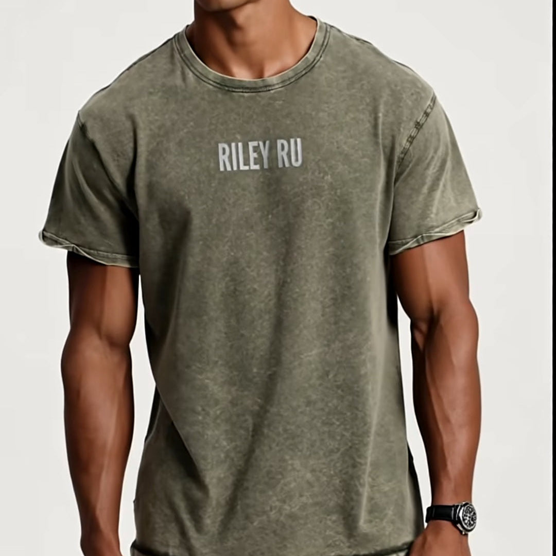 Man wearing a green t-shirt with 'RILEY RU' branding on a white background