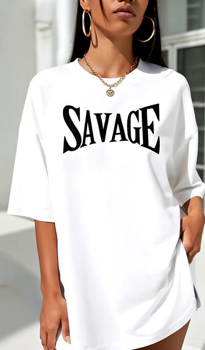Person wearing a white t-shirt with 'SAVAGE' printed on it, standing outdoors.