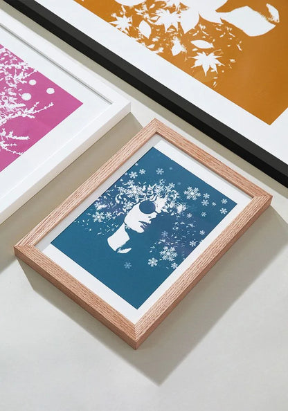 Framed artwork surrounded by other framed pieces.