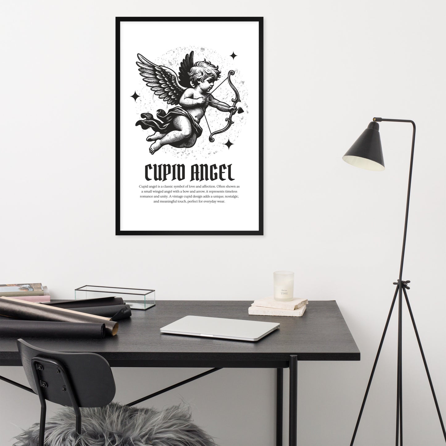 Framed artwork of Cupid Angel on a wall above a desk with office supplies.