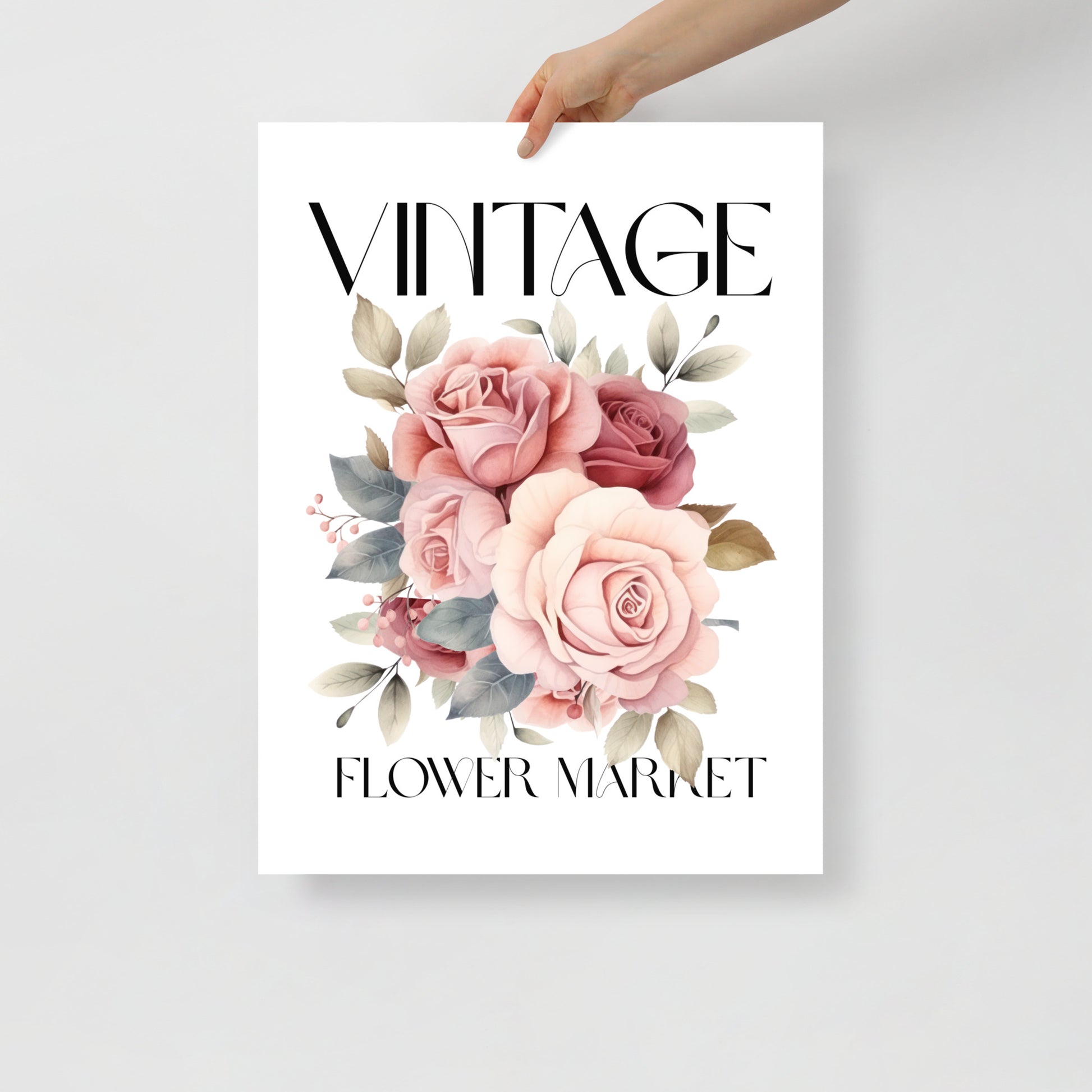 Poster with 'Vintage Flower Market' text and floral design held by a hand on a light gray background