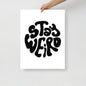 Poster with 'Stay Weird' text held by a hand on a light gray background