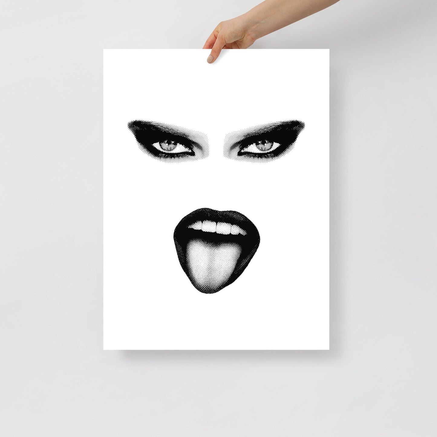 Poster with a stylized black and white face design held by a hand on a light gray background
