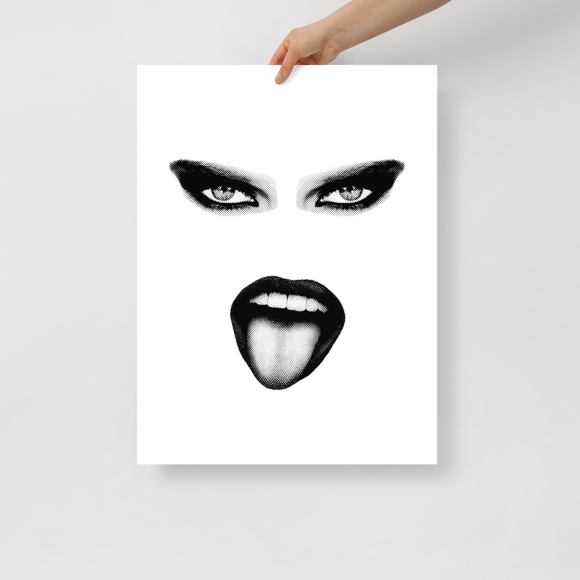 Poster with a stylized black and white face design held by a hand on a light gray background