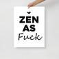 Poster with 'ZEN AS FUCK' text held by a hand on a light gray background