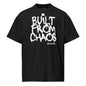Black t-shirt with 'Built from Chaos' text on a white background