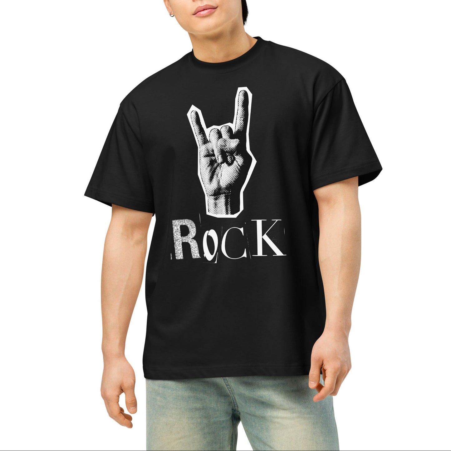 Person wearing a black t-shirt with a hand gesture and 'ROCK' text design on a white background