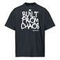 Black t-shirt with 'Built from Chaos' text on a white background