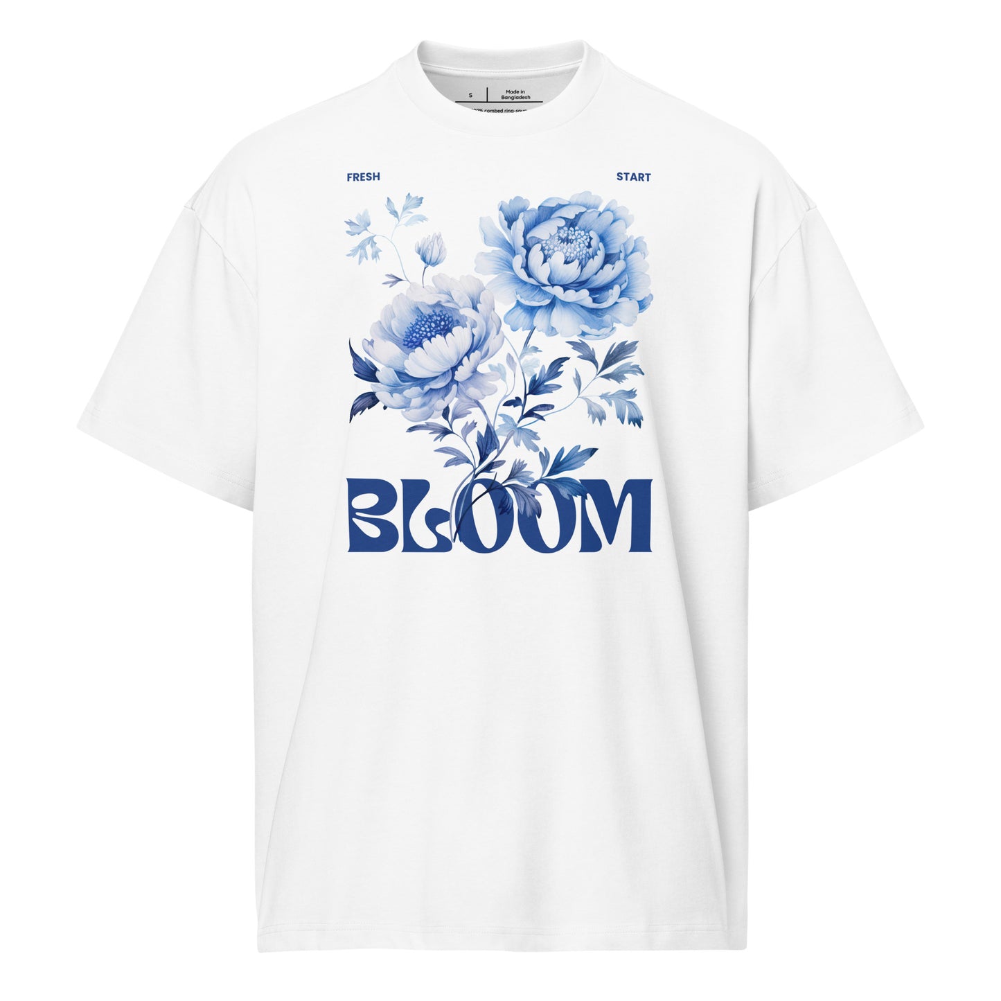 White t-shirt with blue floral design and 'BLOOM' text on a white background
