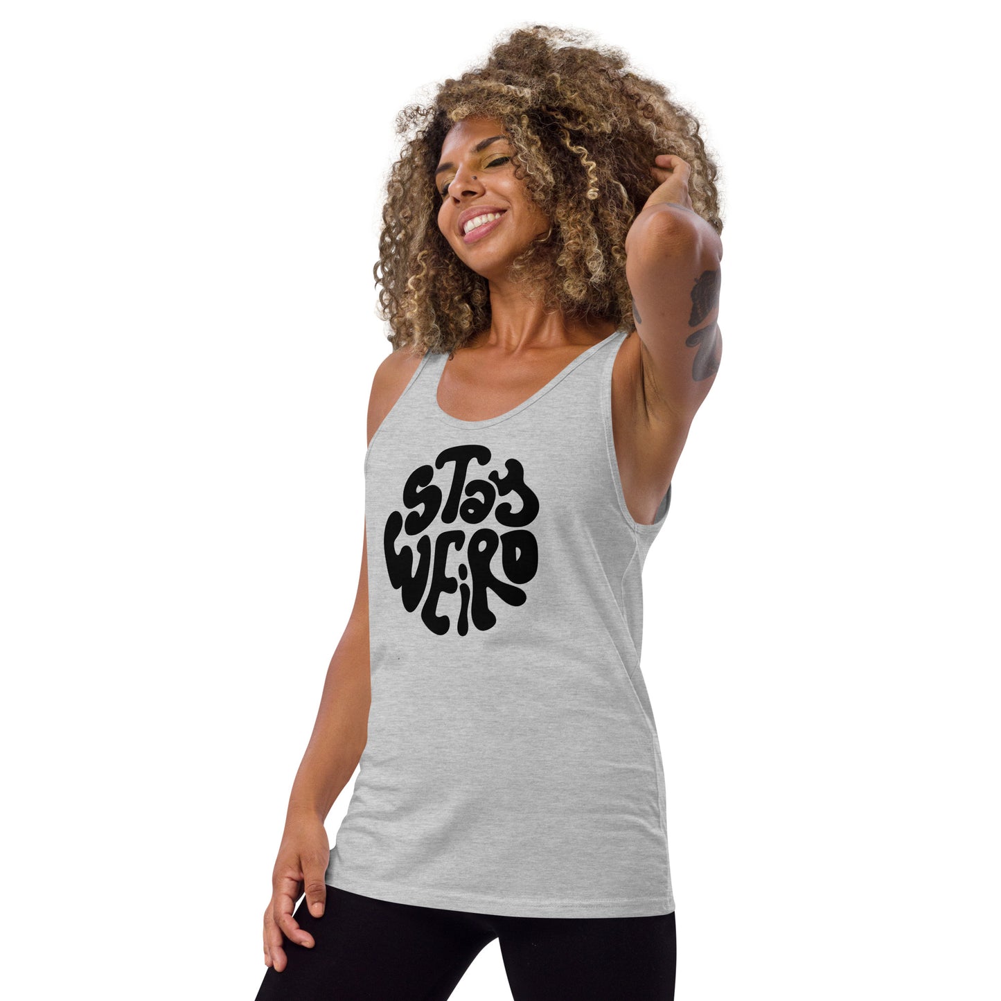 Woman wearing a gray tank top with 'Stay Weird' text on a white background