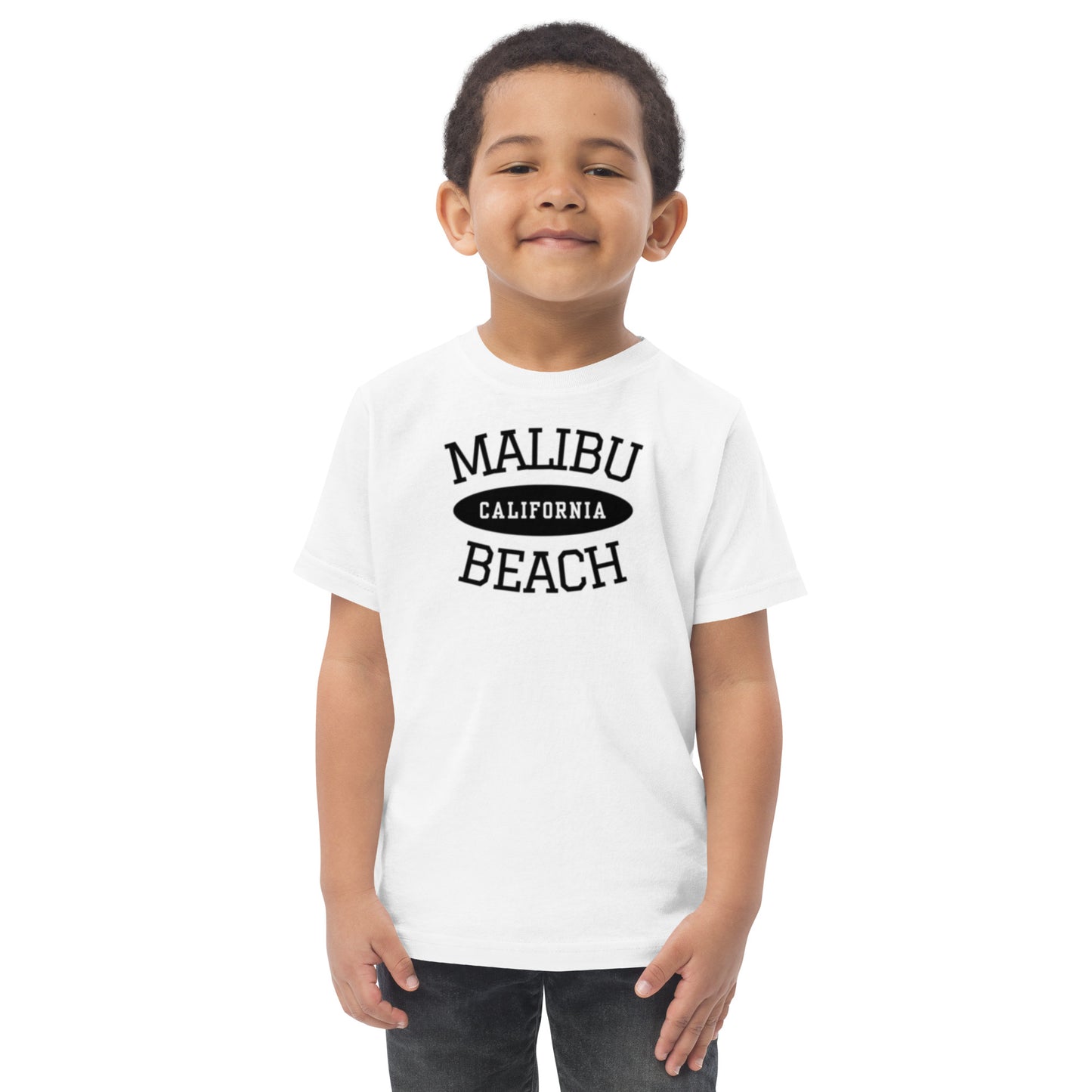 Child wearing a white t-shirt with 'Malibu California Beach' text on a white background