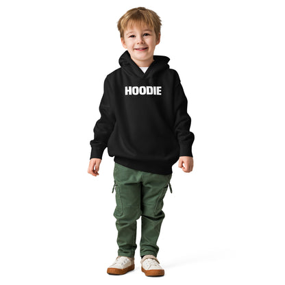 Child wearing a black hoodie with 'HOODIE' text and green pants on a white background
