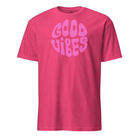 Pink t-shirt with 'Good Vibes' text on a white background
