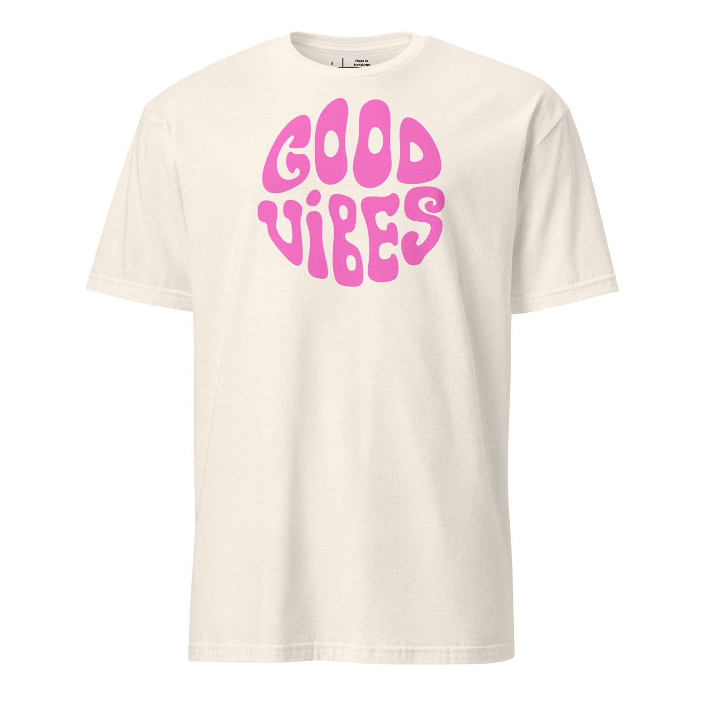 White t-shirt with pink 'Good Vibes' text on a white background