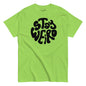 Green t-shirt with 'Stay Weird' text on a white background