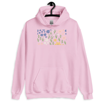 Pink hoodie with floral design on a hanger against a white background