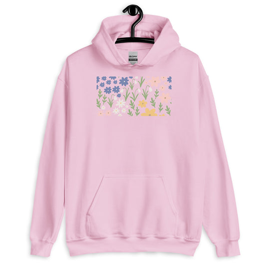 Pink hoodie with floral design on a hanger against a white background