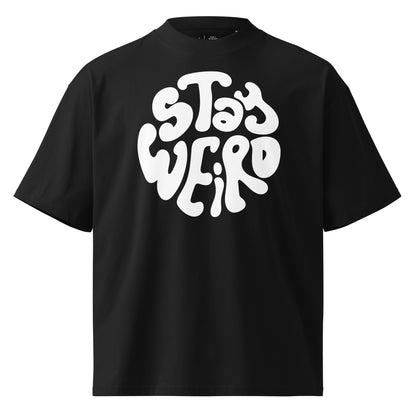 Black t-shirt with 'Stay Weird' text on a white background