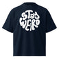 Navy blue t-shirt with 'Stay Weird' text in white on a white background