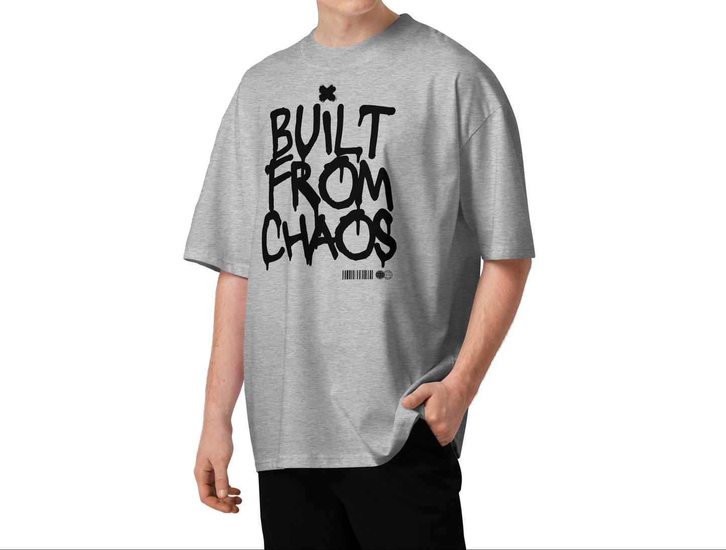 Person wearing a gray t-shirt with 'Built from Chaos' text on a white background