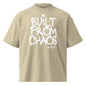 Beige t-shirt with 'Built from Chaos' text on a white background