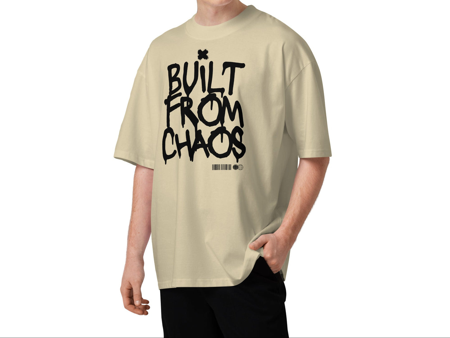 Person wearing a beige t-shirt with 'Built from Chaos' text on a white background