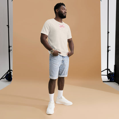 Man wearing a white t-shirt with text and light blue shorts standing against a brown backdrop