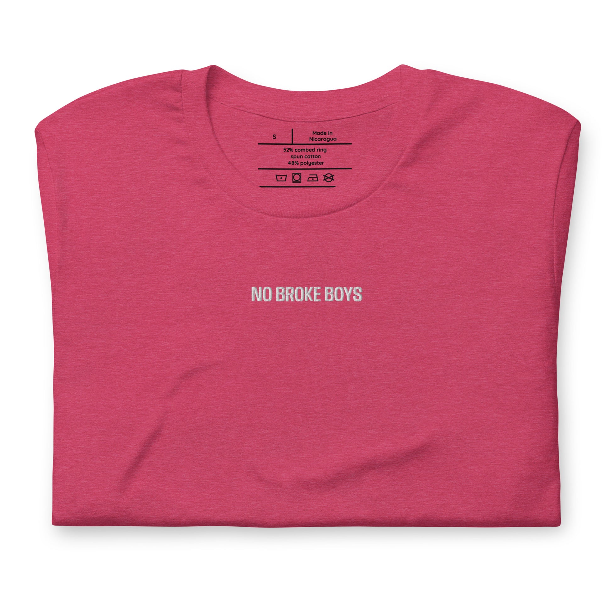 Folded pink t-shirt with 'NO BROKE BOYS' text on a white background